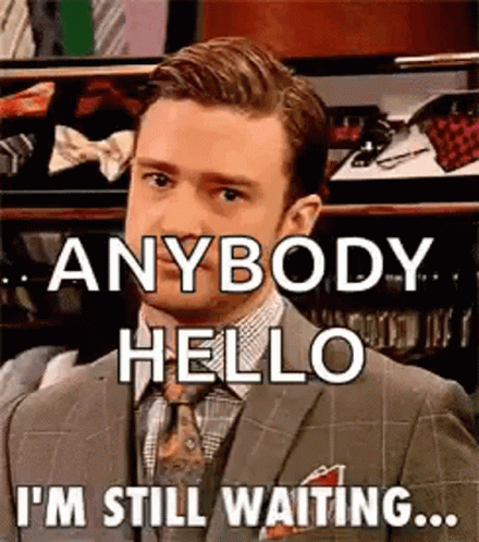 Man in Suit Saying Anybody Hello I'm Still Waiting