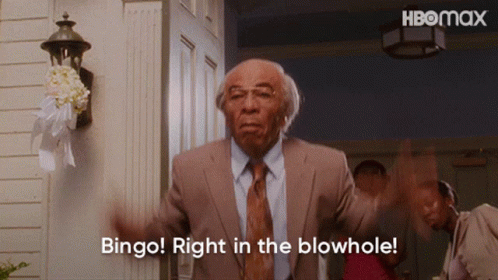 Man in Suit Saying Bingo Right in Blowhole