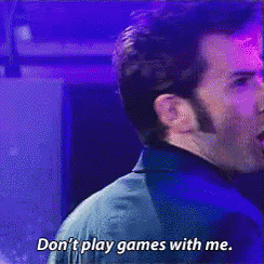 Man in Suit Saying Don't Play Games