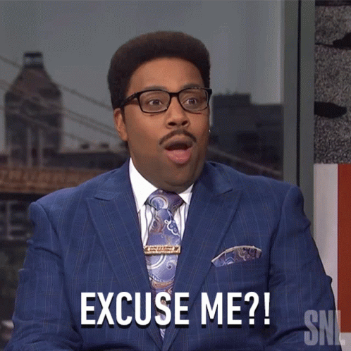 Man in Suit Saying Excuse Me