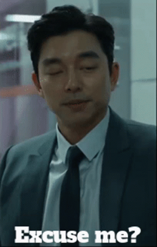 Man in Suit Saying Excuse Me
