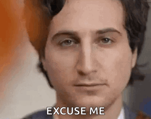 Man in Suit Saying Excuse Me