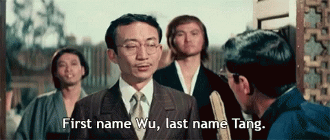 Man in Suit Saying First Name Wu Last Name Tang