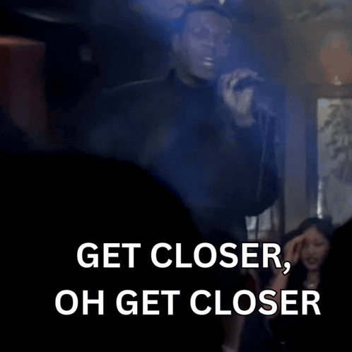 Man In Suit Saying Get Closer GIF