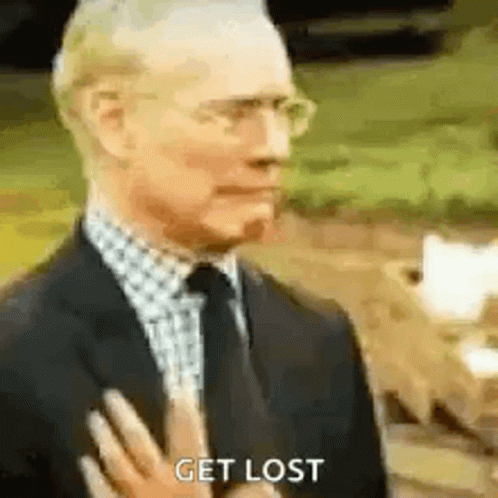 Man in Suit Saying Get Lost