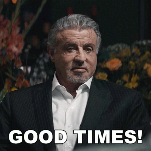 Man in Suit Saying Good Times With Flowers