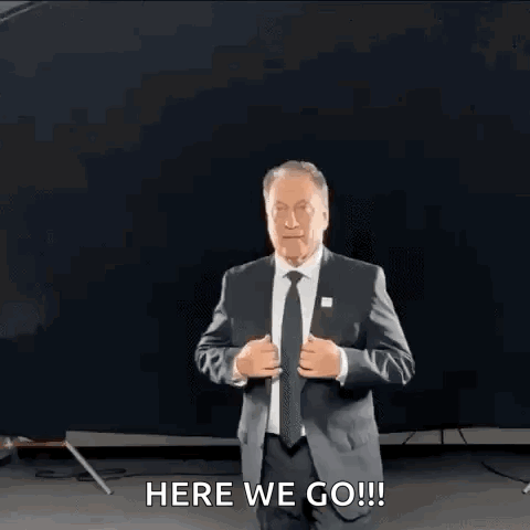 Man in Suit Saying Here We Go