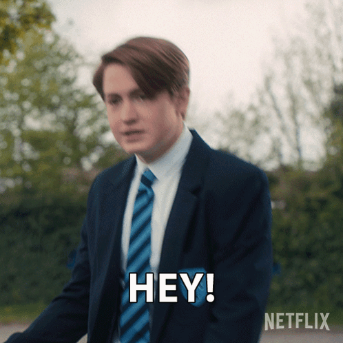 Man in Suit Saying Hey
