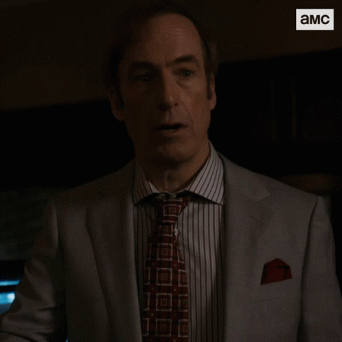 Man in Suit Saying Holy Shit