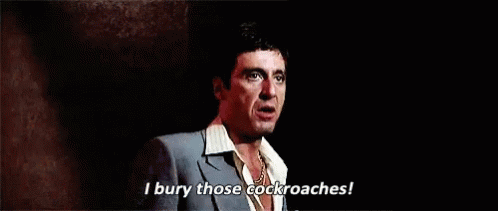 Man in Suit Saying I Bury Those Cockroaches
