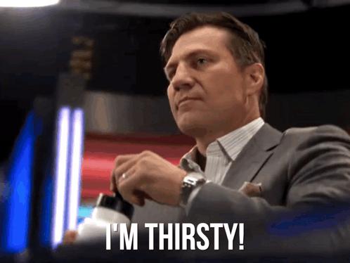 Man In Suit Saying I'm Thirsty Opening Bottle GIF