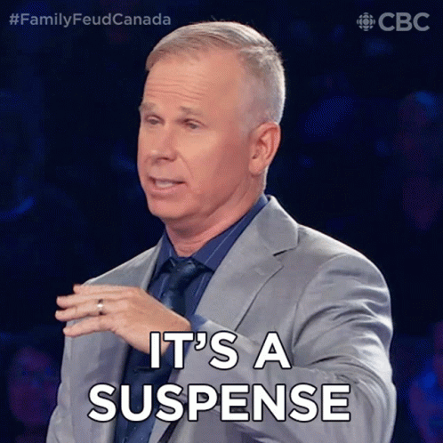 Man in Suit Saying It's a Suspense