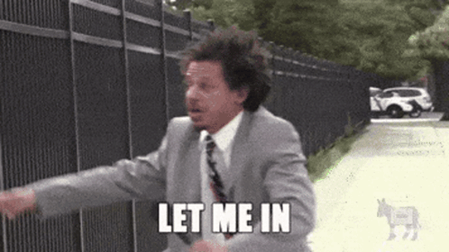 Man in Suit Saying Let Me In