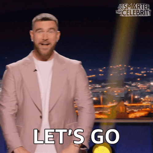 Man in Suit Saying Let's Go on TV Show
