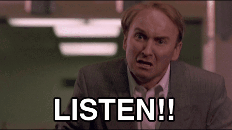 Man in Suit Saying Listen
