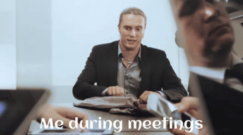 Man in Suit Saying Me During Meetings