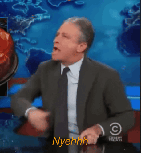 Man In Suit Saying Nyehhh GIF
