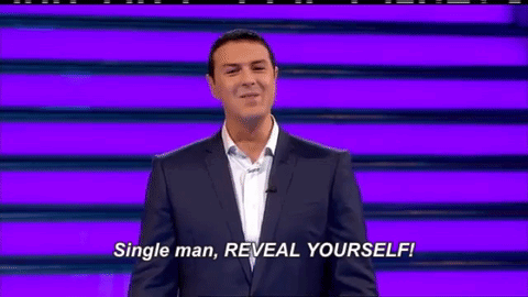 Man in Suit Saying Reveal Yourself