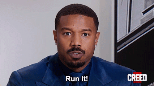 Man in Suit Saying Run It