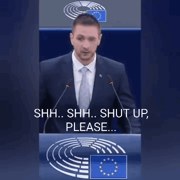 Man in Suit Saying Shh Shh Shut Up Please