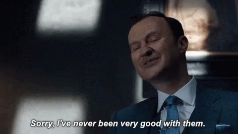 Man in Suit Saying Sorry I've Never Been Very Good With Them
