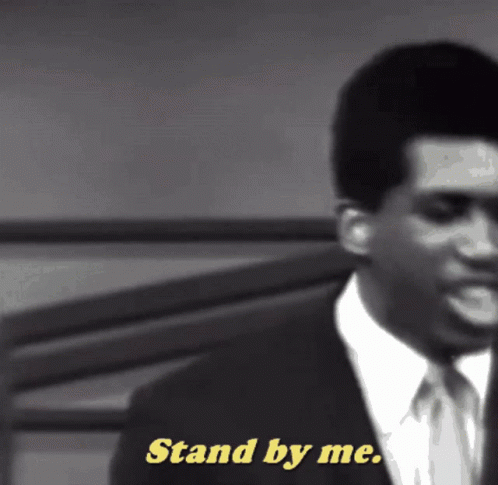 Man in Suit Saying Stand by Me in Yellow