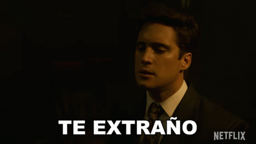 Man in Suit Saying Te Extrano