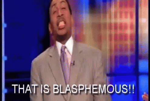 Man in Suit Saying That Is Blasphemous