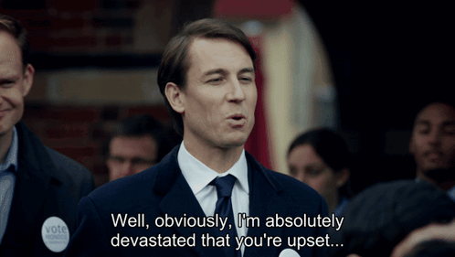 Man in Suit Saying Well Obviously I'm Absolutely Devastated