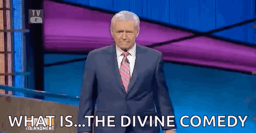 Man In Suit Saying What Is The Divine Comedy In Front Of Purple Wall GIF