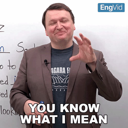 Man In Suit Saying You Know What I Mean In Front Of Whiteboard GIF