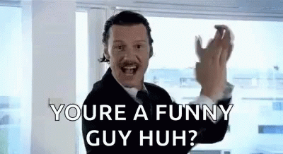 Man in Suit Saying You're a Funny Guy Huh