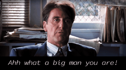 Man In Suit Says Ahh What A Big Man You Are By Window GIF