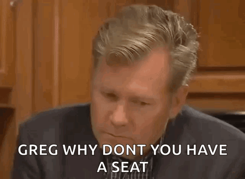 Man In Suit Says Greg Why Dont Have Seat GIF
