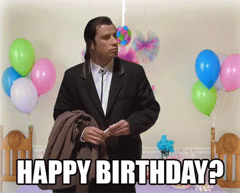 Man in Suit Says Happy Birthday in Front of Balloons