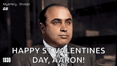 Man in Suit Says Happy St. Valentines Day Aaron