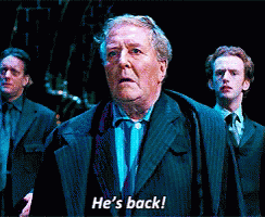 Man In Suit Says He's Back To Two Men GIF