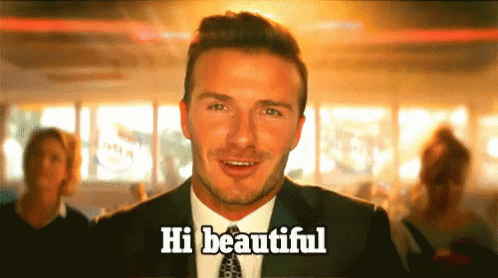 Man in Suit Says Hi Beautiful to Group