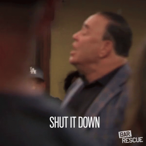 Man in Suit Says Shut It Down in Front of Group