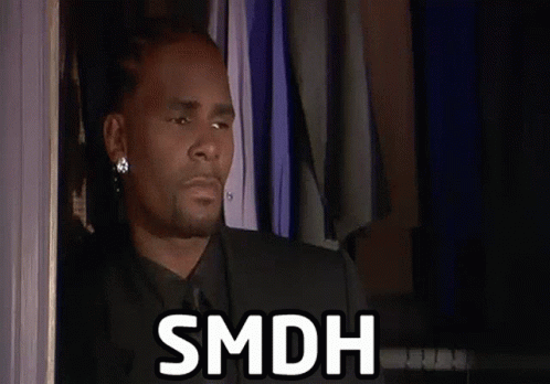 Man In Suit Says SMDH By Full Closet GIF