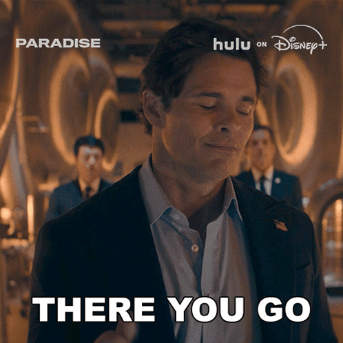 Man in Suit Says There You Go at Paradise Ad