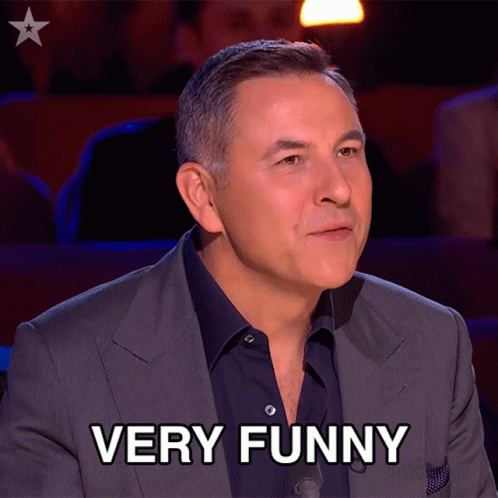 Man in Suit Says Very Funny in Front of Star