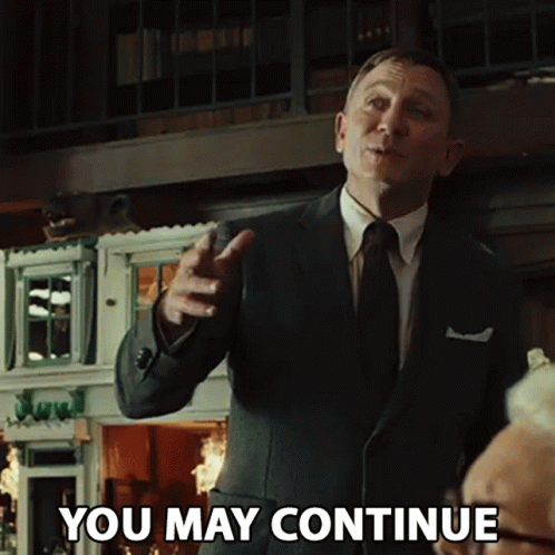 Man In Suit Says You May Continue GIF