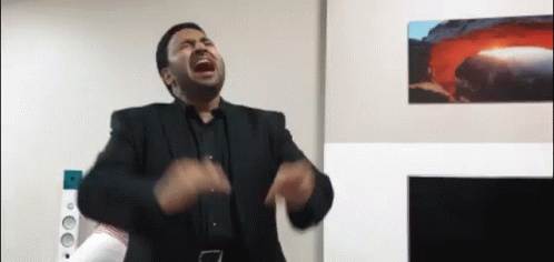 Man in Suit Screaming in Living Room with Volcano