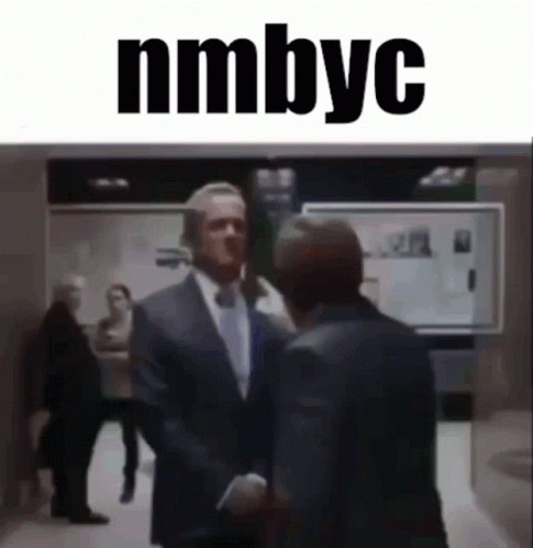 Man in Suit Shaking Hands with nmbyc
