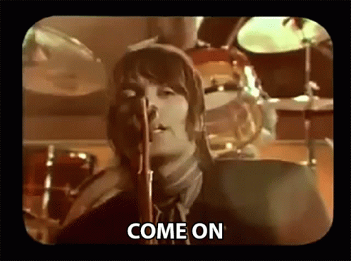 Man in Suit Singing Into Microphone Come On