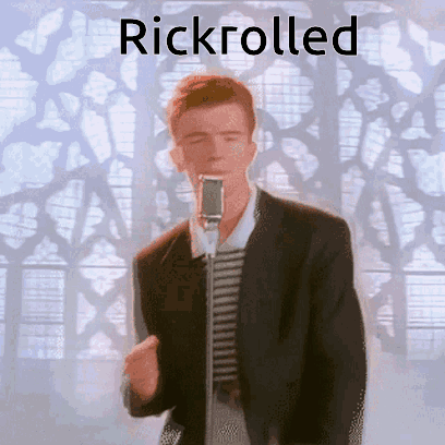 Man in Suit Singing Into Microphone Rickrolled