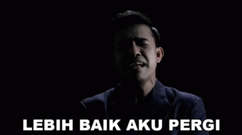 Man in Suit Singing Lebih Baik Aku Pergi