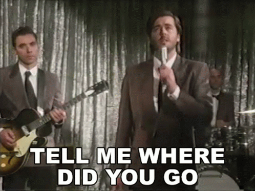 Man in Suit Singing Tell Me Where Did You Go