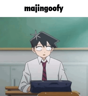 Man In Suit Sitting At Desk In Classroom GIF
